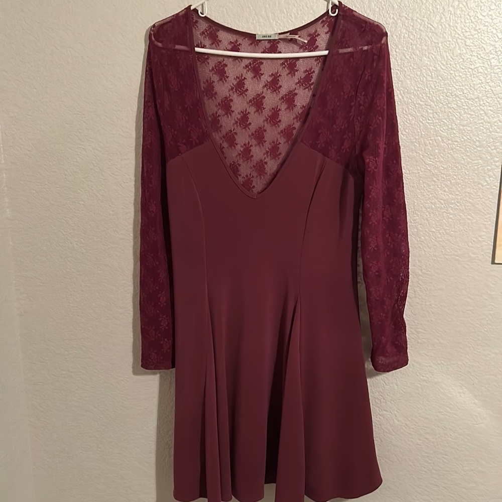 Maroon skater dress with lace sleeves and back